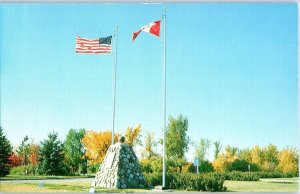 Cairn and Flags at the International Peace Garden Manitoba Canada Postcard