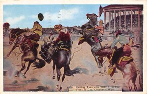 Cowboy Race with Wild Bronchos Frontier Days Cheyenne, Wyoming USA