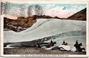 postcard MT Snow field on Swift Current Pass Trail - men on horses, Glacier Park