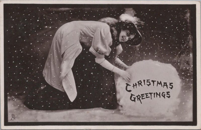 RPPC Postcard Christmas Greetings Woman + Giant Snowball