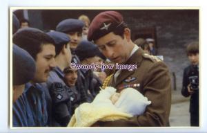 r2576 - Charles holding a Baby of one of the Men in this Army Troop - postcard