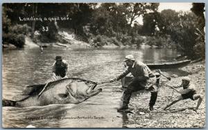 FISHING CANADA ANTIQUE 1910 EXAGGERATED REAL PHOTO POSTCARD RPPC