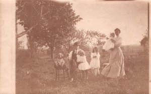 Postcard Young Family Girls Dressed in White Dresses Prairie Real Photo RPPC
