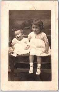 Siblings Children and Babies Sitting on Wooden Chair Photograph Postcard