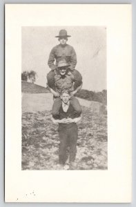 RPPC Soldiers as Totem Pole Stacked on Shoulders Photo Postcard J23