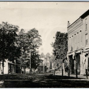 c1910s Mystery Downtown View RPPC Main St Stores Dirt Road Real Photo PCard A96