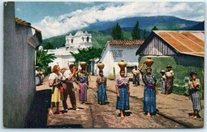 M-18965 Guatemalan women carrying water home in large earthen Jugs Guatemala