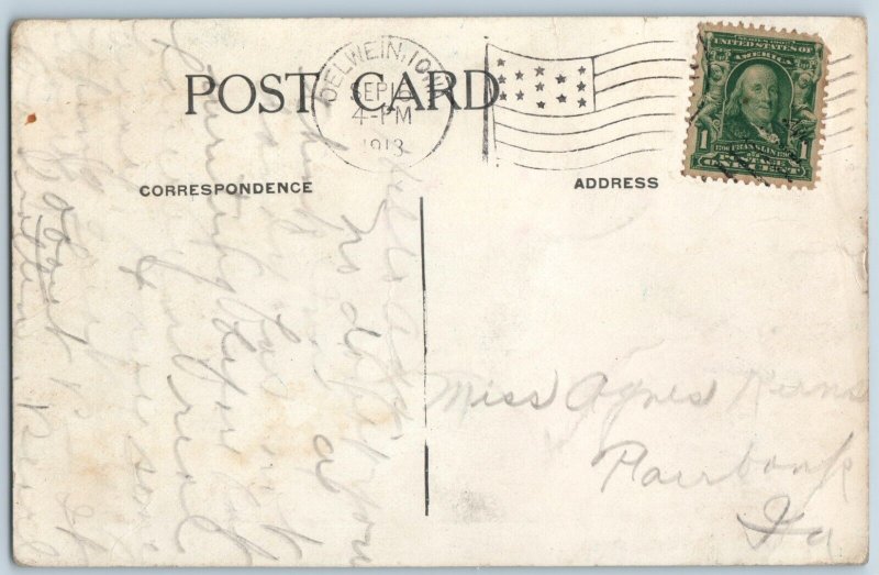 c1910s Oelwein, IA Pioneer Cabin 1853 Sign 1st House Residence Men Postcard A196