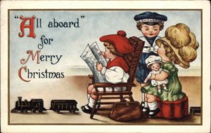 CHRISTMAS Children w Toy Train Boy w Conductor Cap c1910 Postcard