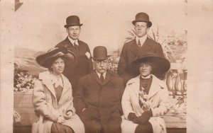 RPPC postcard Men Bowler Hats Women Large Hats