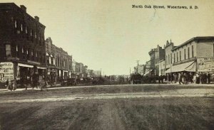 Watertown SD Postcard North Oak Street Scene Stores People Cars