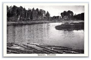 Spooner Wisconsin Lake With Logs Postcard