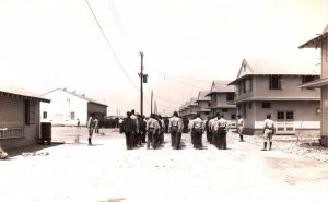 VINTAGE POSTCARD SOLDIERS ON PARADE AND BARRACKS PRE-WW II (US) REAL PHOTO