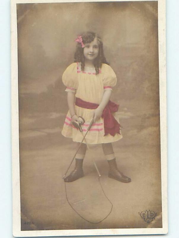 c1910 rppc foreign CUTE GIRL PLAYING WITH ANTIQUE STRING TOY HM1356