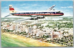 National Airlines DC-7 Star Flying Over Miami Beach 1950s Postcard