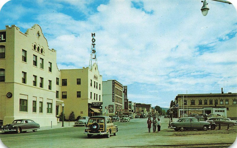 Coeur d'Alene ID Sherman Ave. Storefronts Old Cars Woodie Postcard