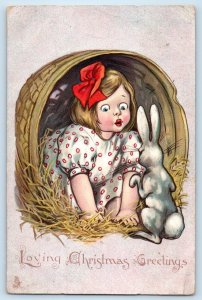 Christmas Greetings Child Girl In The Basket Rabbit Embossed Antique Postcard