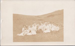 Lethbridge Alberta People on Hillside Dressed in White AB RPPC Postcard E80