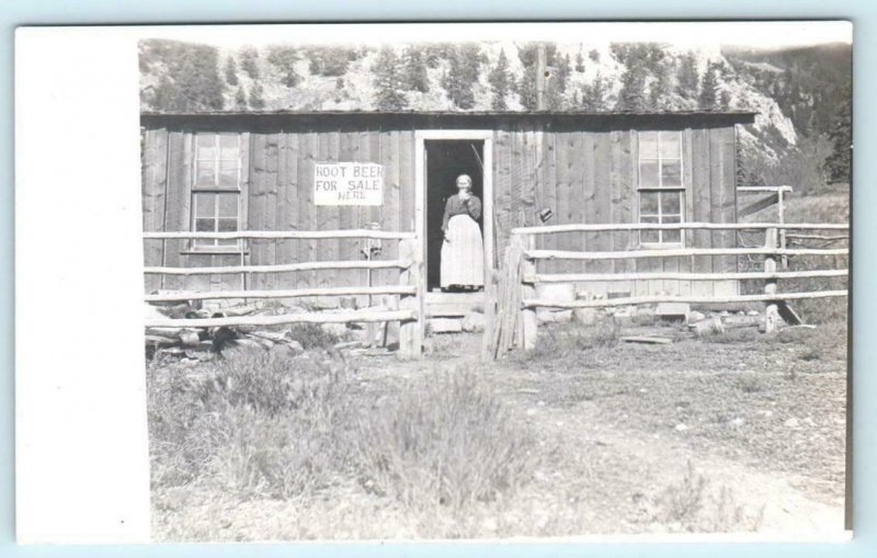 RPPC  Location ?? ~ EARLY CABIN Woman & Sign ROOT BEER FOR SALE c1910s Postcard