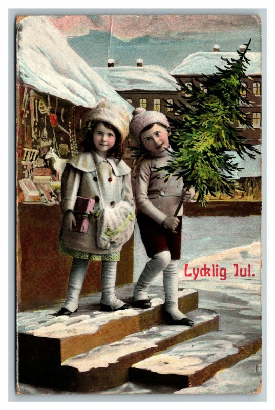 c1910 Swedish Lycklig Jul Christmas Tree Boy Girl Snow Toy Store Postcard pc2582