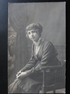 Studio Portrait: Women sitting in a chair c1916 Possibly Russian - RP Postcard