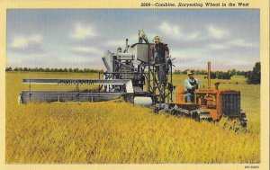 Harvester Combine and Tractor Harvesting Wheat in the West