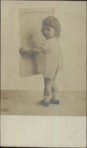 Little Girl Reading Chicago Evening Post Newspaper c1905 Real Photo Postcard