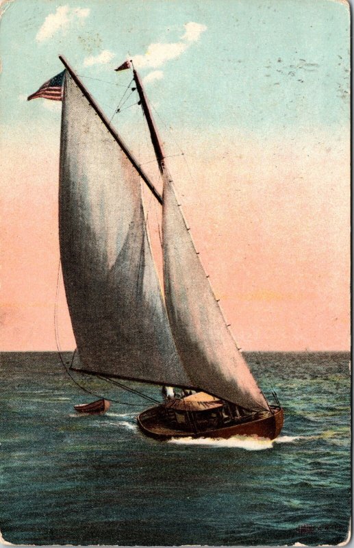 VINTAGE POSTCARD WIND SAIL BOAT US FLAG AND IN-TOW LISTED AS HAIR 4-4-11 (LRC)