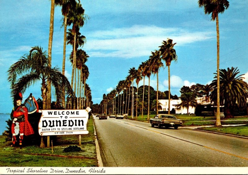 Florida Dunedin Welcome Sign Showing Shoreline Drive