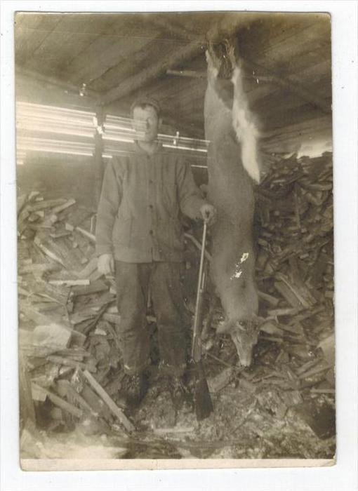 051  Deer Hunter Standing next to his trophy Deer