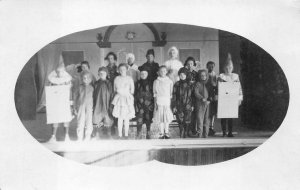RPPC CHILDREN HALLOWEEN COSTUMES SCHOOL PLAY REAL PHOTO POSTCARD (c. 1910)