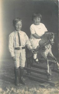 Postcard RPPC Photo UK Christchurch Children Rocking horse Coronation 22-13306