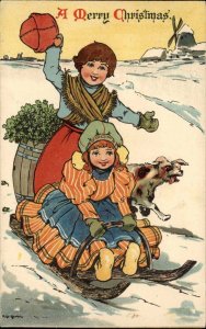 Nister No. 339 A/S Christmas Dutch Boy and Girl with Dog Sledding Vintage PC