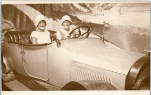 1920s Two Women Posing in a Studio Prop Car Flappers RPPC Real Photo Postcard