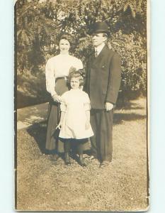 Pre-1920 rppc CUTE GIRL WITH BOW IN HAIR & BOTTON SHOES WITH PARENTS r6468