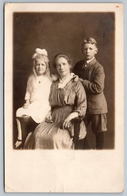 Postcard RPPC c1910s Studio Photo of Mother and Two Kids Dressed