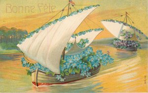 Embossed chromo litho greetings fantasy postcard floral sailing boats