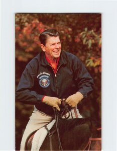 Postcard An ever-fit President Reagan as he rides on a favorite steed