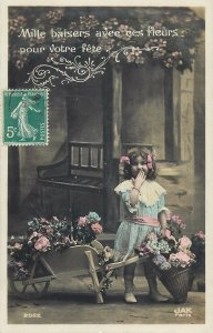 young flower girl vintage outfit fancy hair ribbon wheelbarrow basket Post card