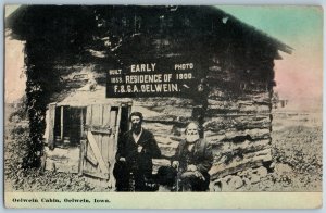 c1910s Oelwein, IA Pioneer Cabin 1853 Sign 1st House Residence Men Postcard A196