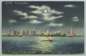 Miami Florida~Skyline View & Boats On River At Night~Vintage Postcard