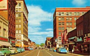 WATERLOO IA~BUSY FOURTH STREET-BUSINESS & STOREFRONTS-CARS-REXALL 1955 POSTCARD
