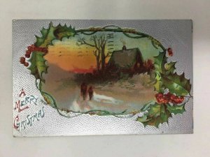 c. 1910 Merry Christmas Postcard Holly Cottage People Snow Silver Embossed