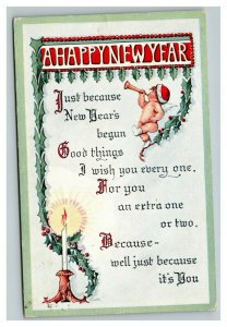 Vintage 1913 New Year's Postcard Angel in Santa Hat Blows Horn Mistletoe Candle