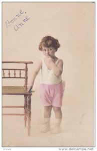 Toddler wearing pink shorts, 00-10s