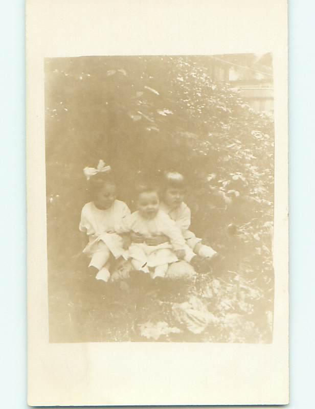 Pre-1920 rppc CUTE GIRL WITH BOW IN HAIR WITH OTHER KIDS r6475