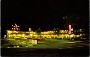 Postcard Nigh View of Town and Country Motel in Worland, Wyoming