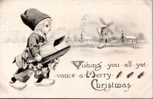 Postcard Dutch Boy with sled - Vishing you all yet vonce a Merry Christmas