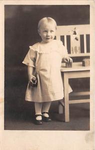 Little girl next to a chair Blocks & small bear Child, People Photo Unused 