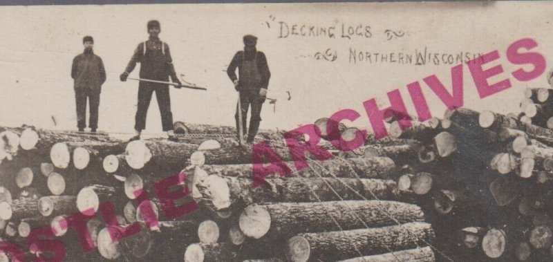Wausau WISCONSIN RPPC 1925 LOGGING SCENE Lumberjacks DECKING LOGS Colby Photo WI